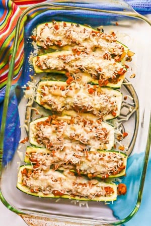 Baked turkey sausage stuffed zucchini boats in a glass baking dish