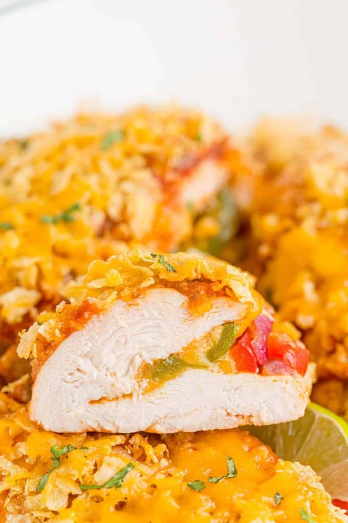 A sliced cheesy fajita stuffed chicken breast with a crunchy topping