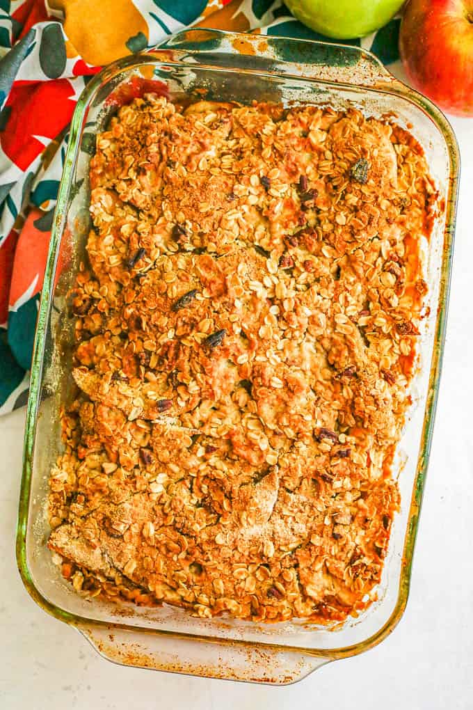 Baked apple crisp in a glass baking dish after coming out of the oven