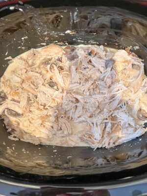Crock pot chicken in a cream cheese sauce with onions and mushrooms