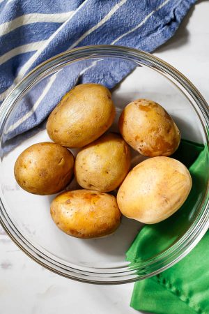 Yukon potatoes in a large glass bowl