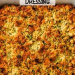 Browned cornbread dressing in a white casserole dish with a text overlay on the photo