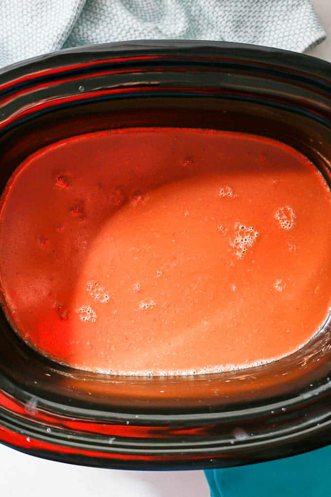 Creamy, rich crock pot hot chocolate in the crock pot before being served