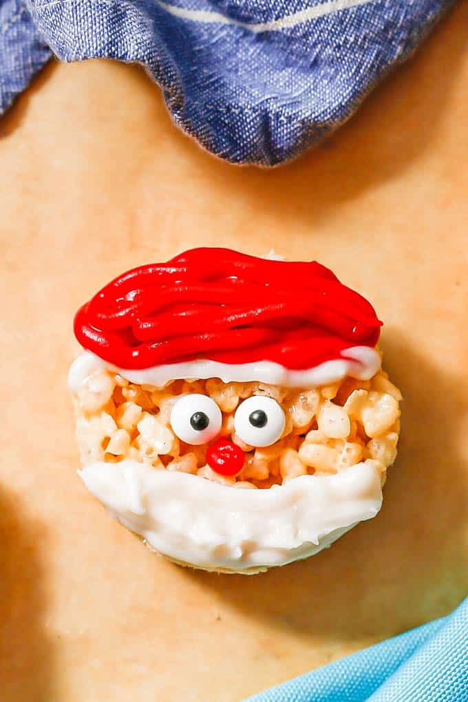 Close up of a Santa Claus Rice Krispie treat with a red hat and white beard