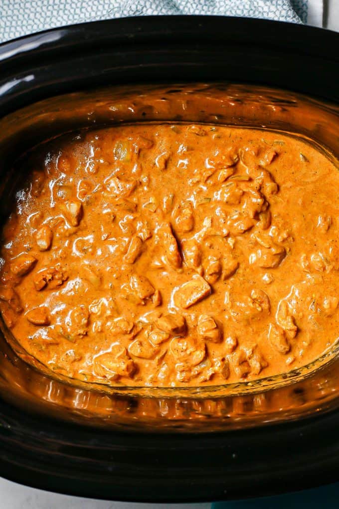 Slow cooker butter chicken in the insert after being cooked.