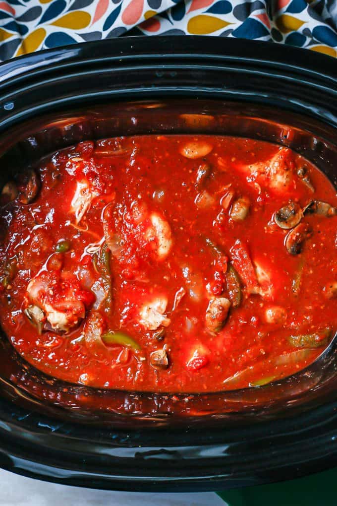 Slow cooker chicken cacciatore in the insert after finishing cooking.
