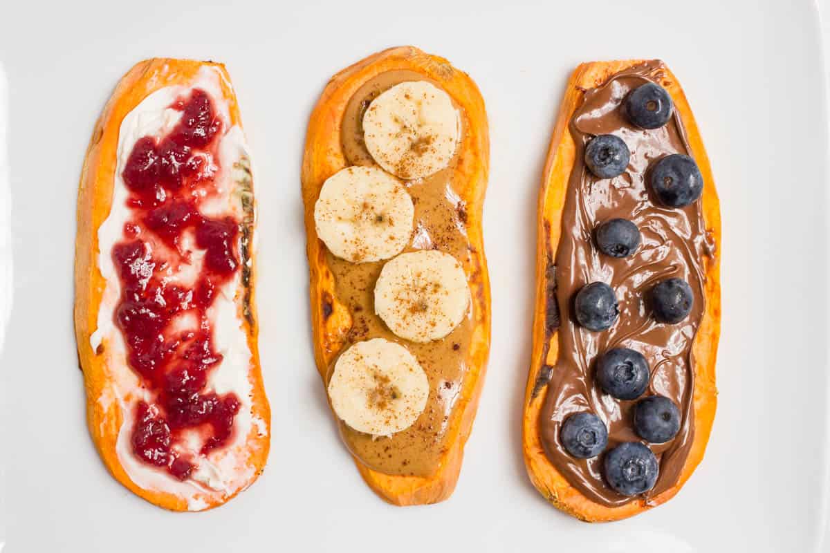 Three slices of sweet potato toast with different sweet spreads and toppings.