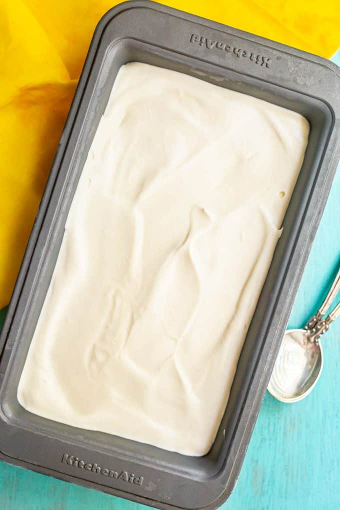 A 9x5 bread pan filled with a smooth homemade vanilla ice cream.