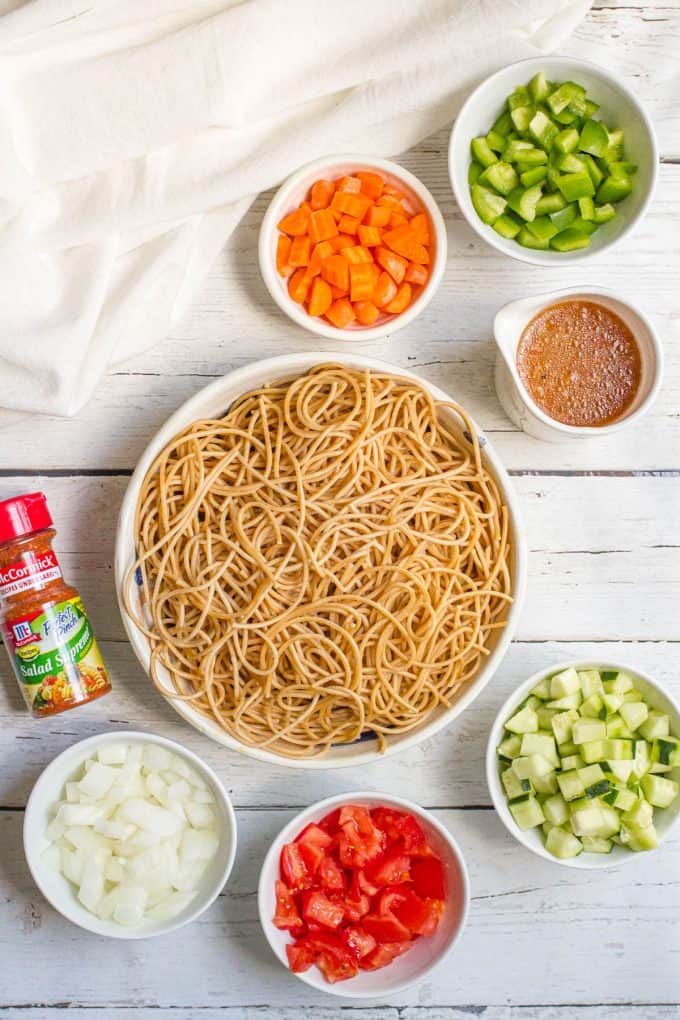 Ingredients laid out for making cold veggie spaghetti salad.