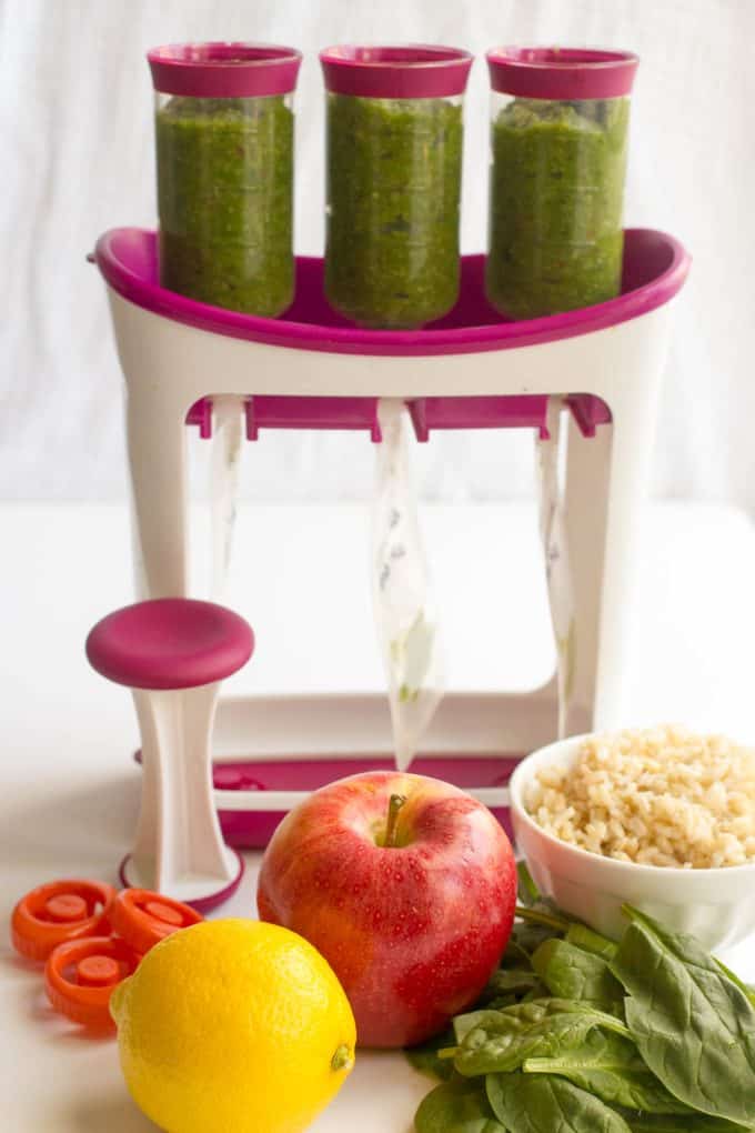 A baby food squeeze pouch filling station being used to make spinach apple rice baby food pouches.