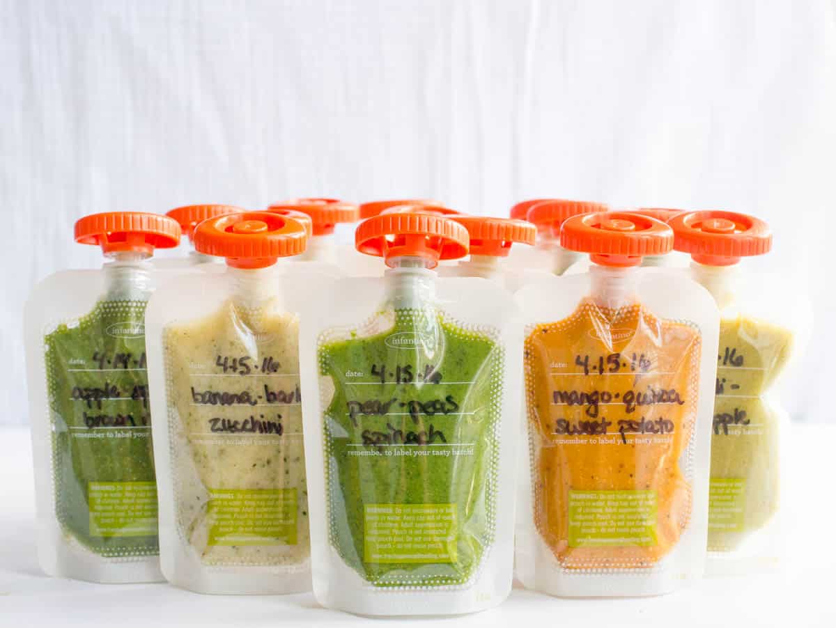 Rows of different homemade baby food pouches with the names of the different combinations written on the front.