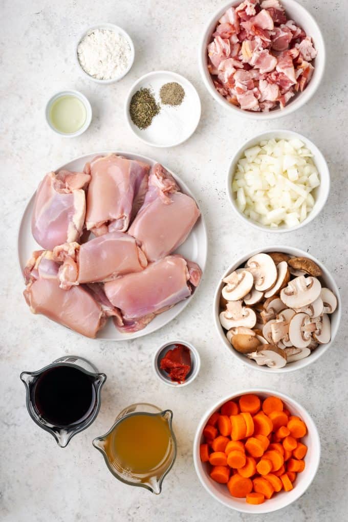 Ingredients laid out in separate bowls for a seared chicken and mushroom dish.