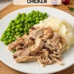 Cranberry Dijon chicken served alongside mashed potatoes and peas on a white dinner plate with a text overlay on the photo.
