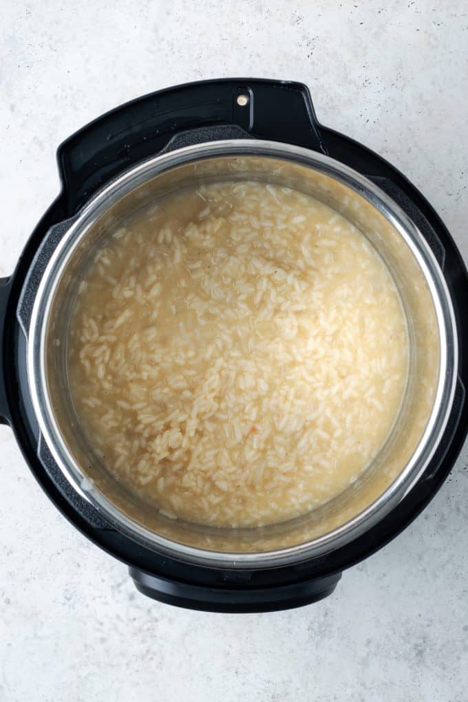 Creamy risotto being cooked in an Instant Pot.