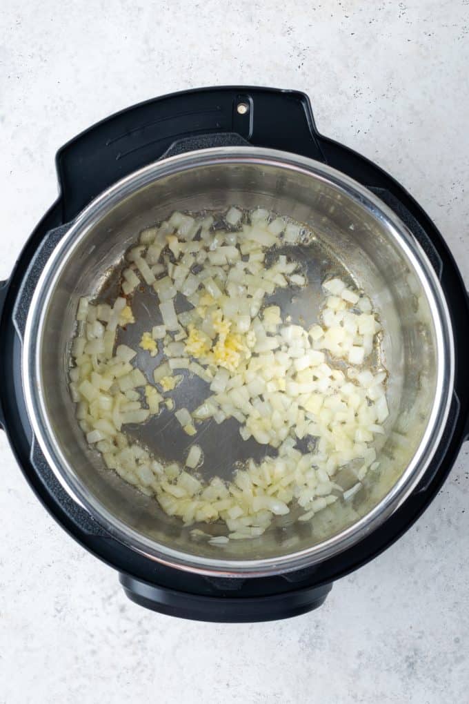 Sautéed onion and garlic in an Instant Pot.
