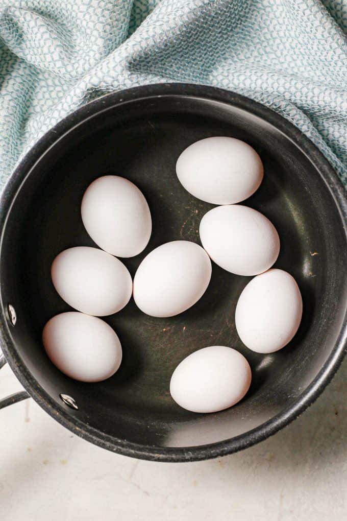 8 eggs in a large pot before being cooked.