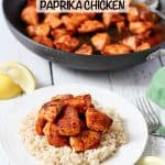 A small white round plate with fluffy steamed brown rice topped with seared paprika chicken cubes with the skillet in the background and a text overlay on the photo.