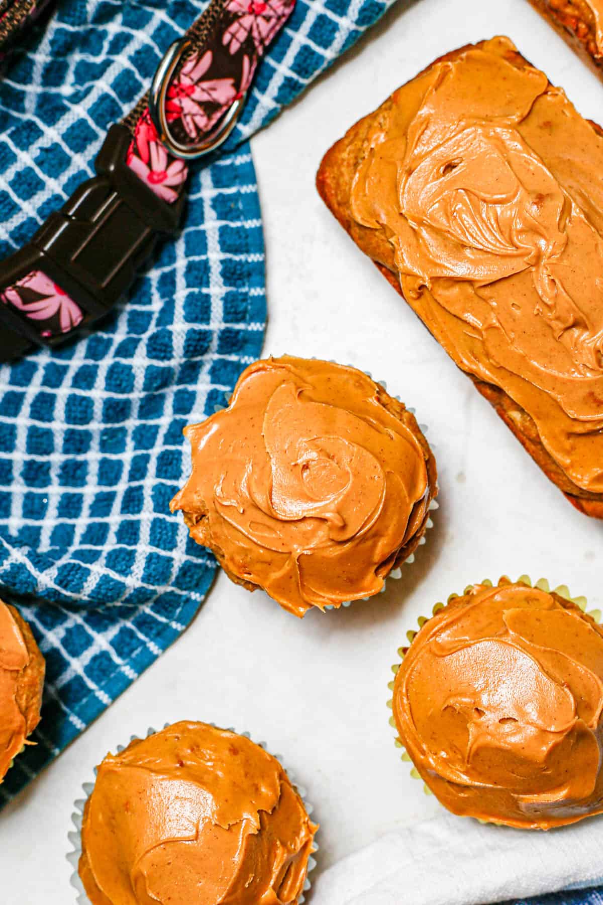 Close up of dog cupcakes with peanut butter on top as frosting.