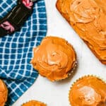 Close up of dog cupcakes with peanut butter on top as frosting with a text overlay on the photo.