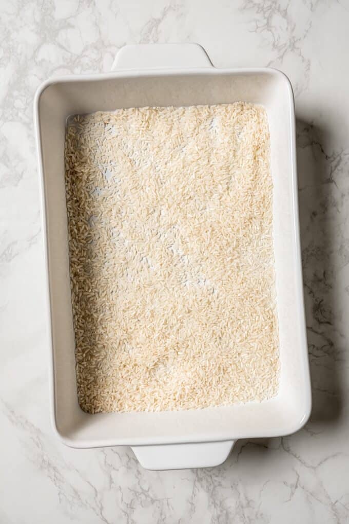 White rice in a rectangular white baking dish.
