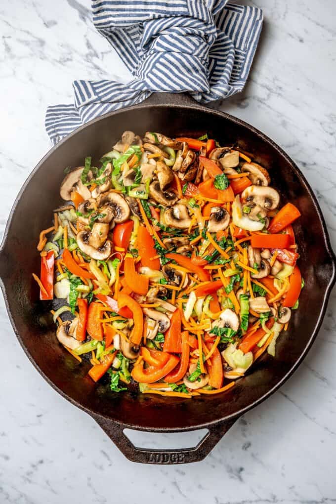 Stir fried veggies in a cast iron skillet.