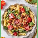 Two bowls full of a BLT pasta salad with a creamy homemade dressing with a border and text overlay around the photo.