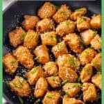 A saucy honey garlic chicken skillet with sesame seeds and sliced green onions sprinkled on top and a bowl of rice to the side with a border and text overlay around the photo.