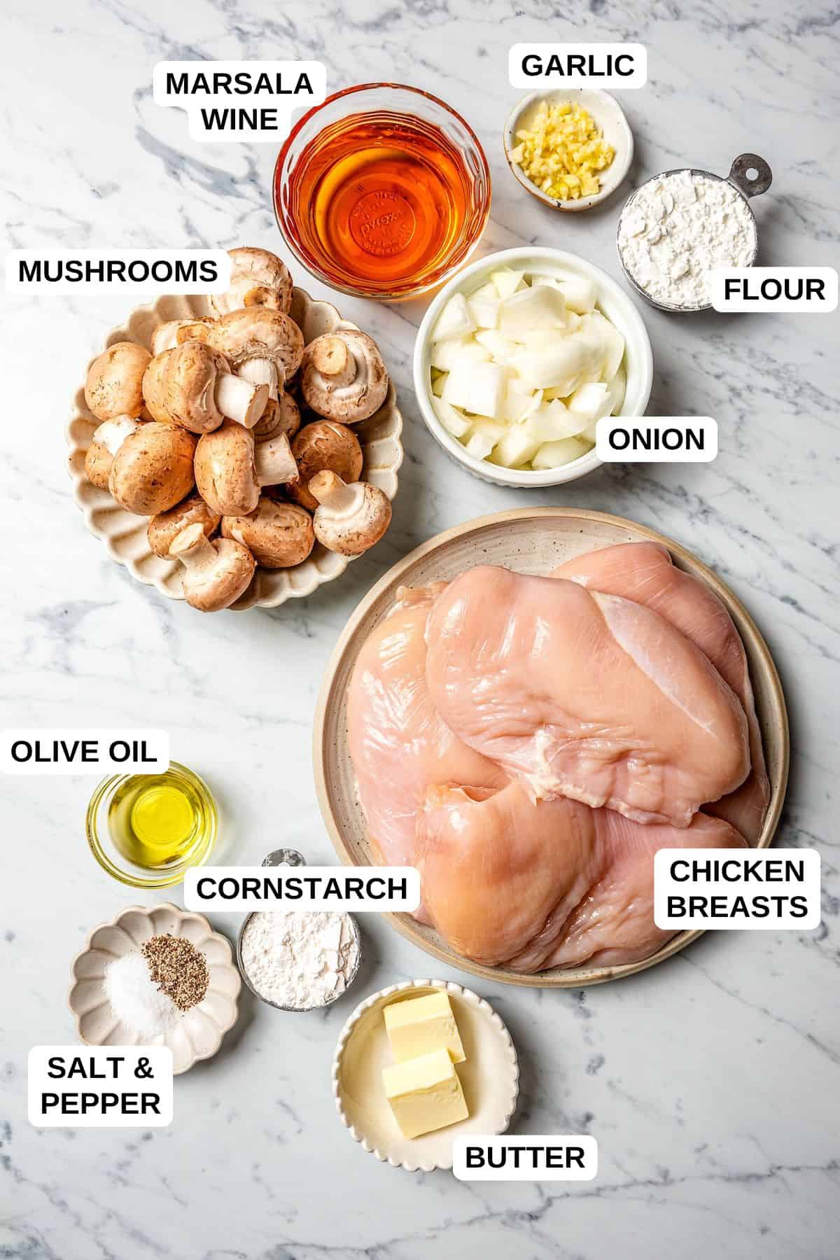 Ingredients laid out in separate containers for making a chicken recipe with mushrooms and marsala wine.
