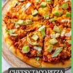 Close up of sliced homemade taco style pizza with lettuce and avocado and a border and text around the photo.