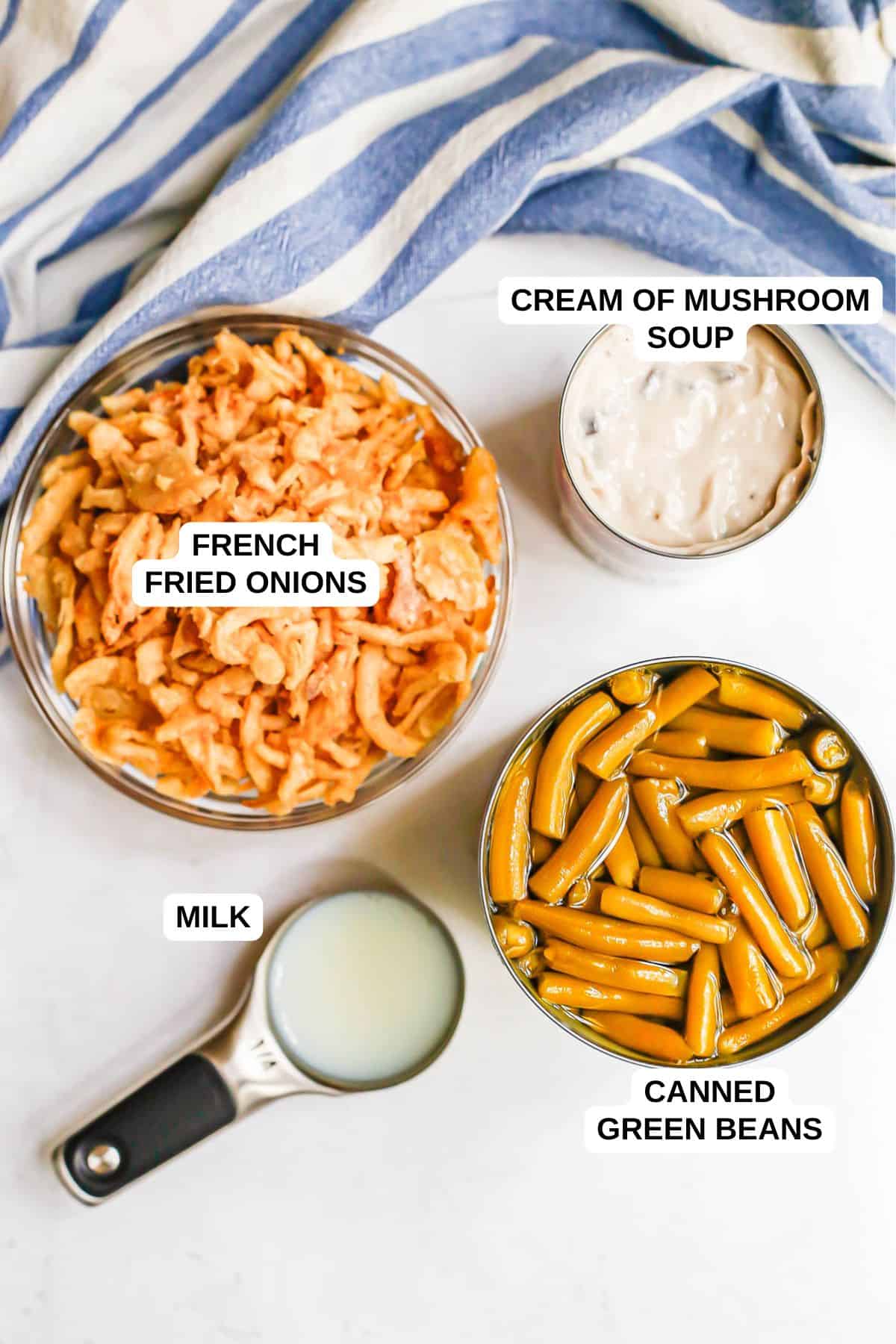 Ingredients laid out on a counter for making a green bean casserole with French fried onions.