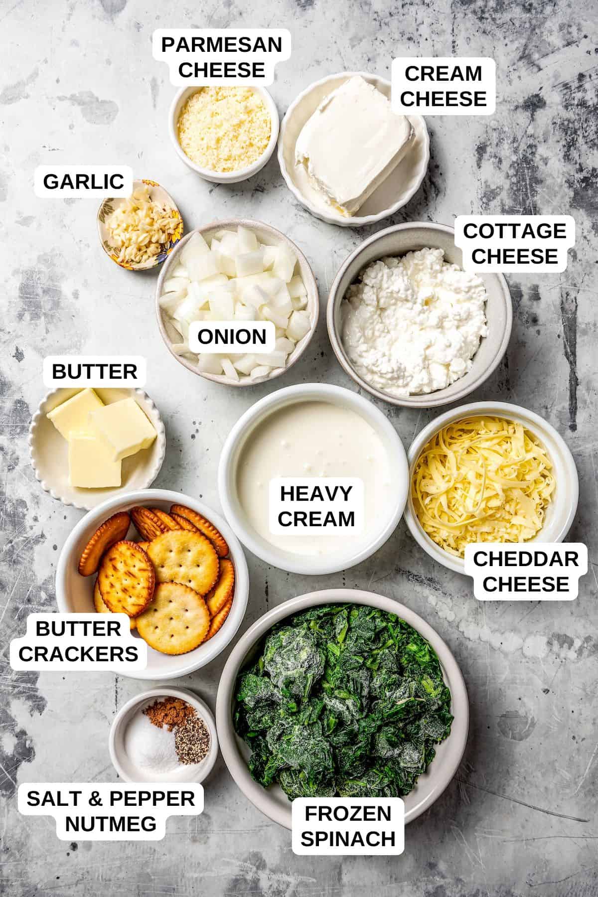Ingredients laid out in separate containers for making a creamed spinach recipe.
