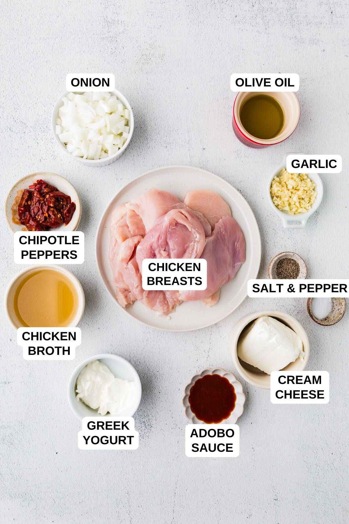 Ingredients laid out in separate containers for making a chicken recipe with chipotle peppers and adobo sauce.