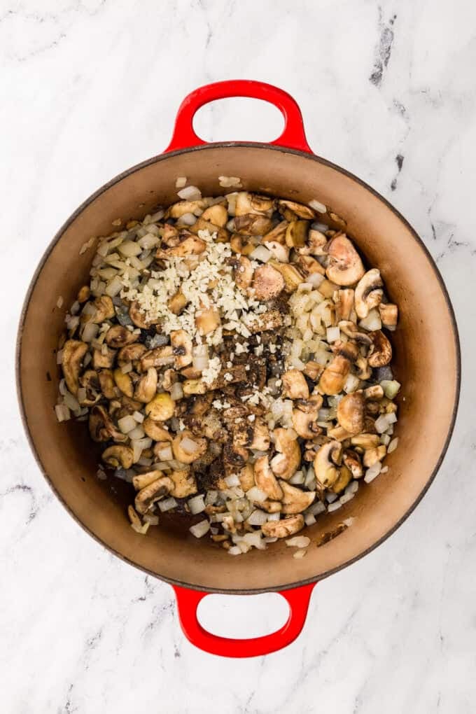 Sautéed onions, mushrooms and garlic in a large deep pot.