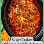 A slow cooker chicken enchilada soup with black beans, corn and tortillas and sliced green onions on top and a green border and text around the photo.