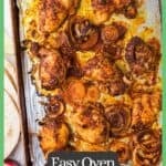Chicken shawarma and onions on a foil lined baking sheet after roasting in the oven with a green border and text around the photo.