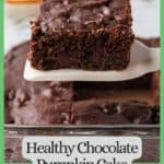A square piece of chocolate pumpkin cake being lifted up from a baking dish with a green border and text around the photo.
