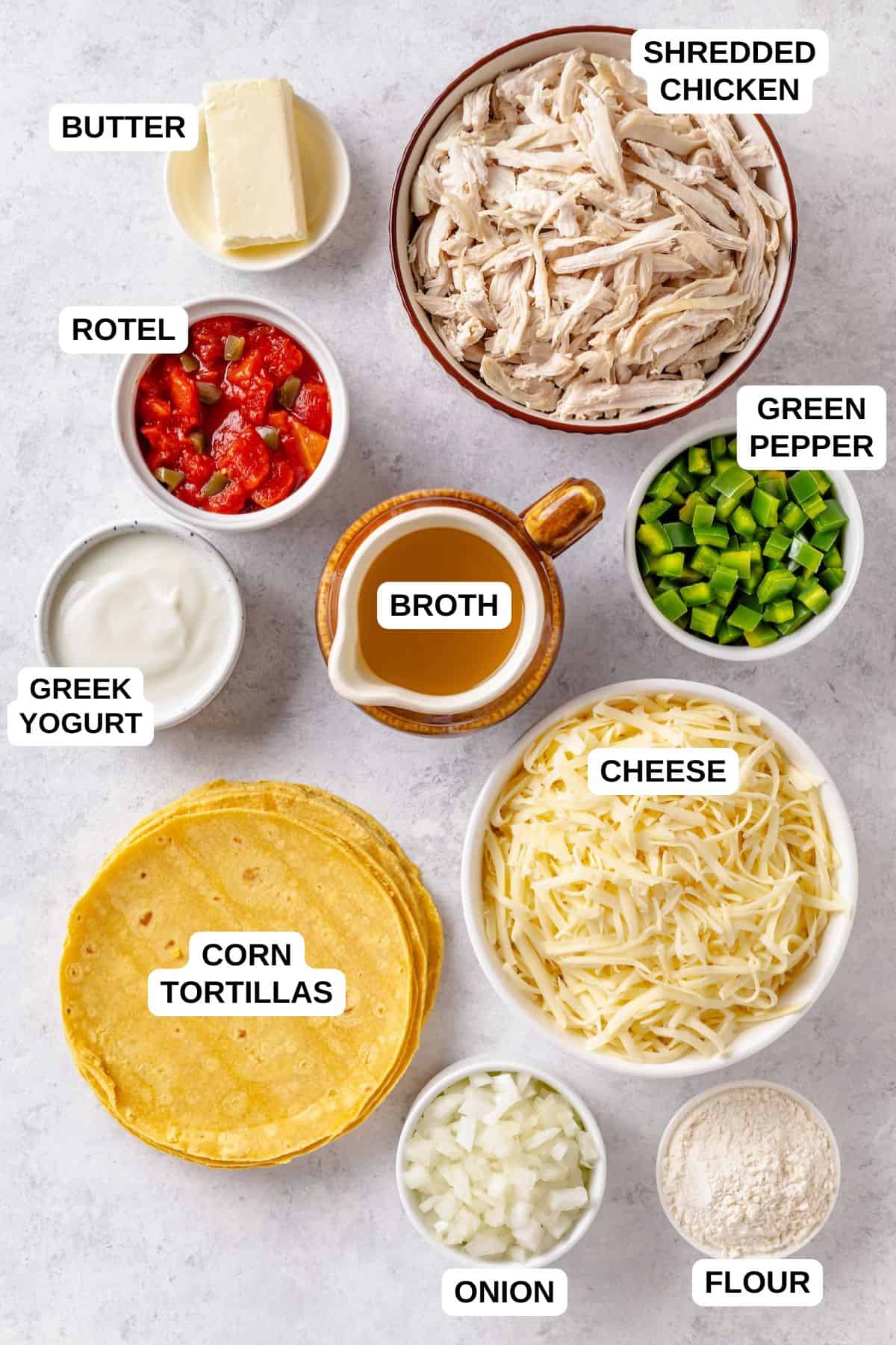 Ingredients laid out in separate bowls for making a chicken casserole recipe with corn tortillas and cheese.