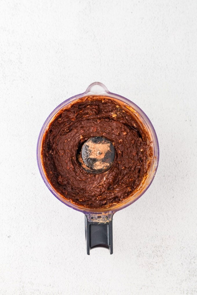 A blended chocolate mix in a food processor.