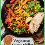 A vegetarian fajitas skillet with peppers, zucchini and black beans in a cast iron pan with charred tortillas to the side and a border and text around the photo.