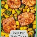 A sheet pan with four pork chops nestled in among roasted potatoes and broccoli with a green border and text around the photo.