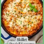 A skillet ravioli lasagna in a deep blue skillet with melted mozzarella and fresh basil on top and a green border and text around the photo.