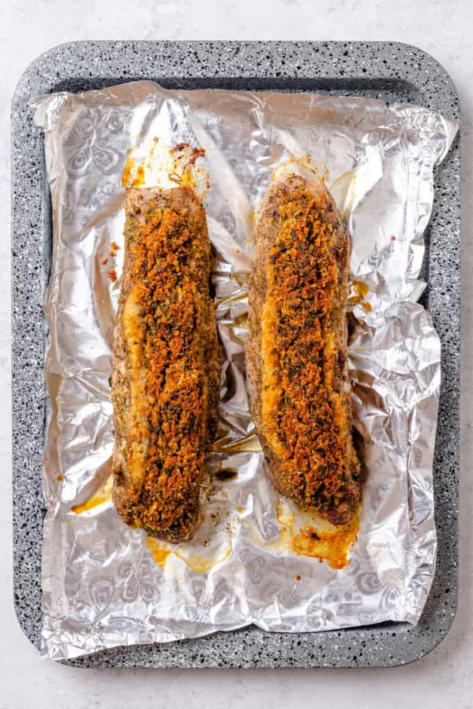 Two roasted pork tenderloins stuffed with a cheese and herb breadcrumb mixture.