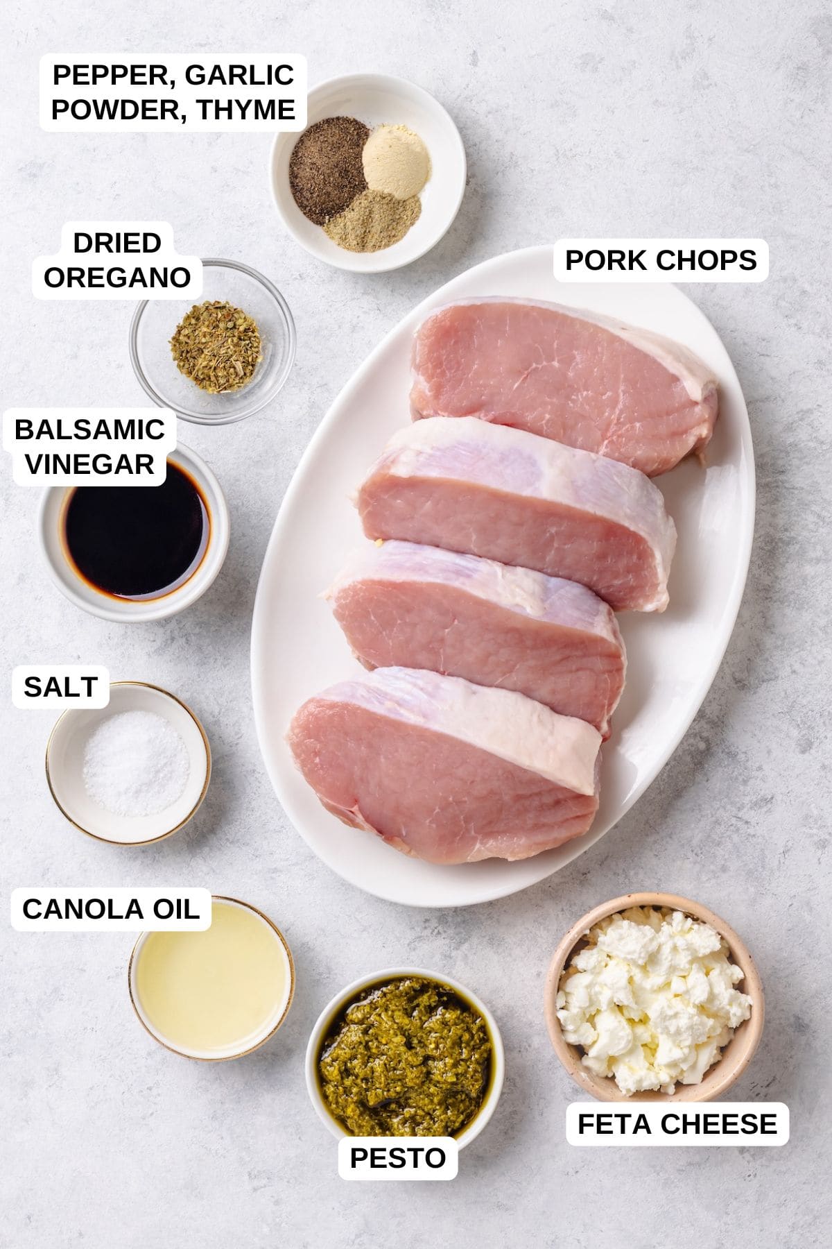 Ingredients laid out in separate containers for making a pork chop recipe with pesto and feta cheese.