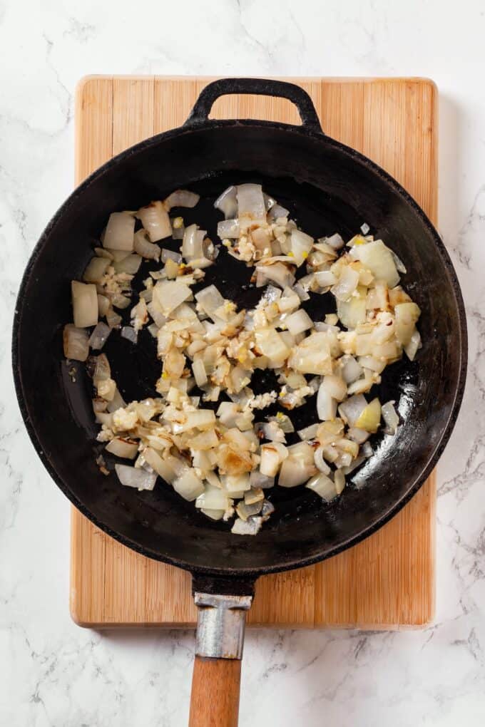 Sautéed onion and garlic in a skillet.