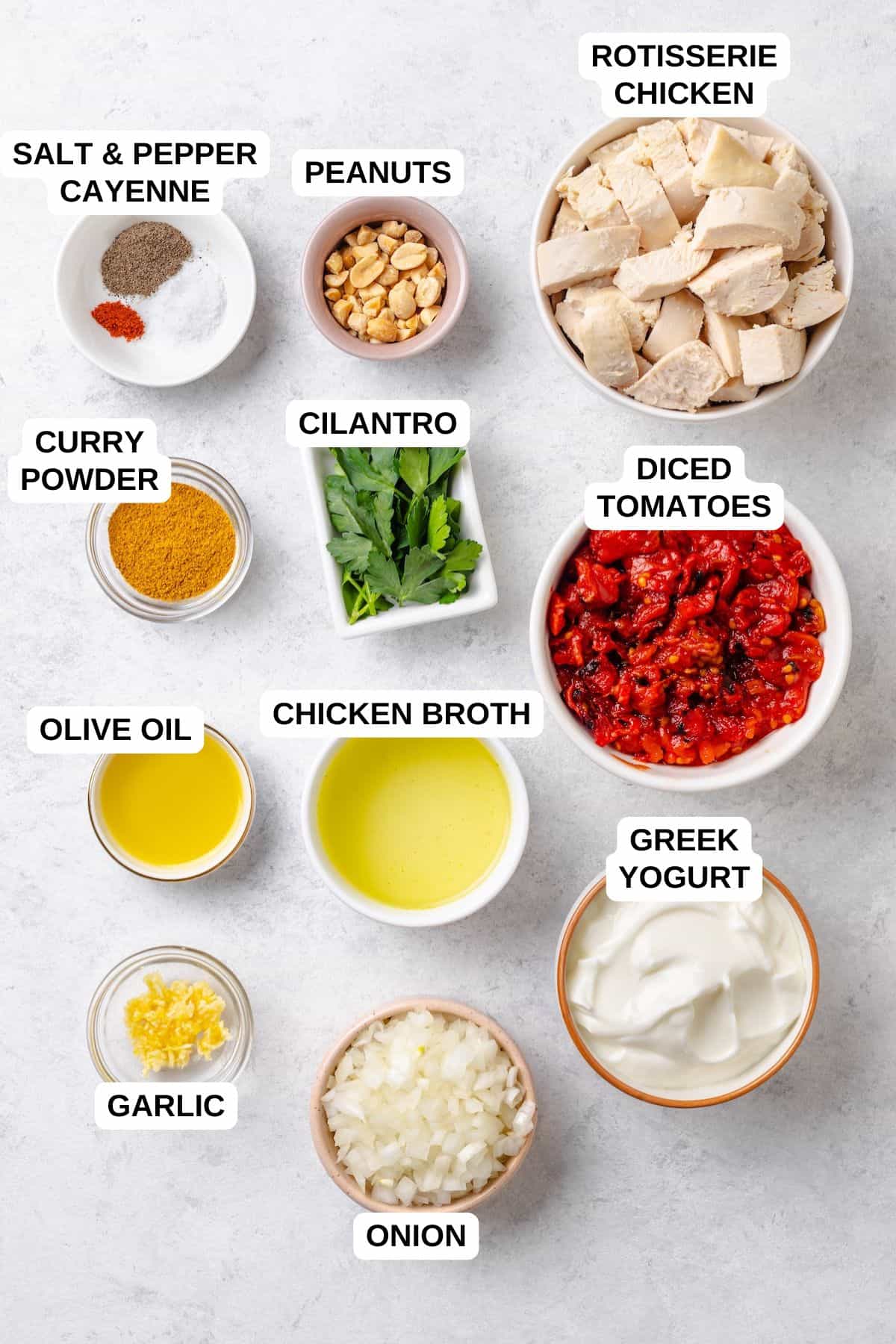 Ingredients laid out in separate bowls for making a shortcut quick chicken curry recipe.