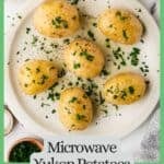A plate full of cooked Yukon potatoes with butter, salt and parsley on top with a green border and text around the photo.