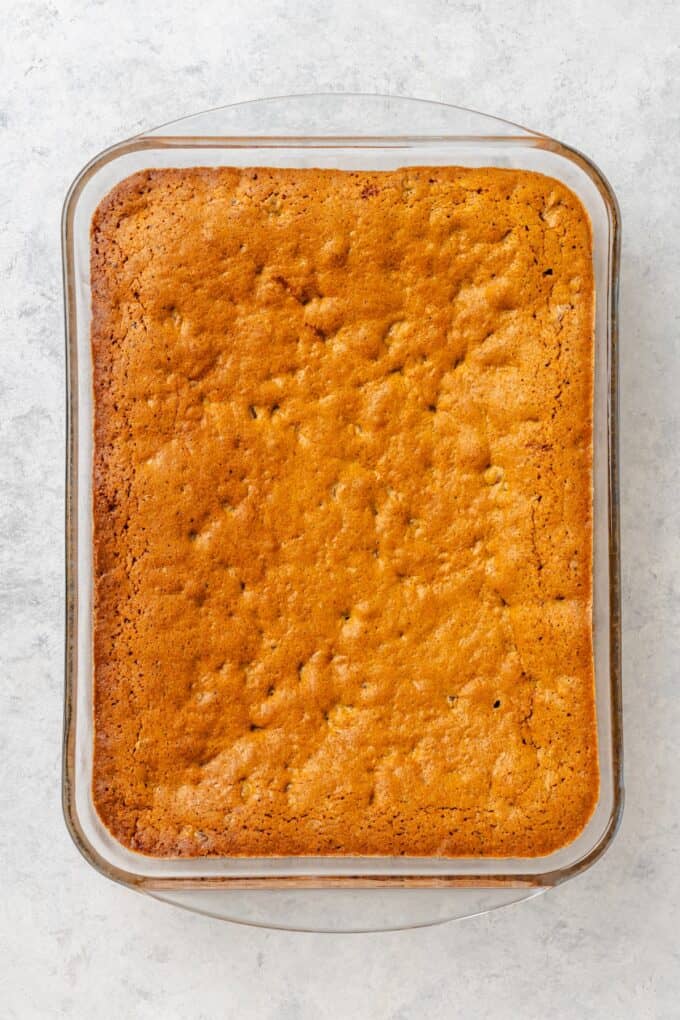 Browned and baked Southern chew bread in a glass casserole dish.
