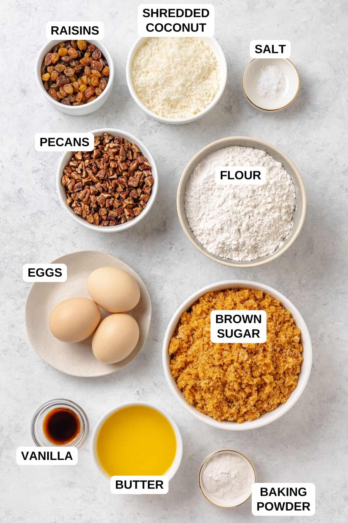 Ingredients in separate bowls for making a Southern sweet bread with raisins, pecans and shredded coconut.