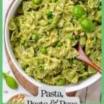 A pasta dish with pesto and peas in a large serving bowl with a wooden spoon resting in it with a green border and text around the photo.