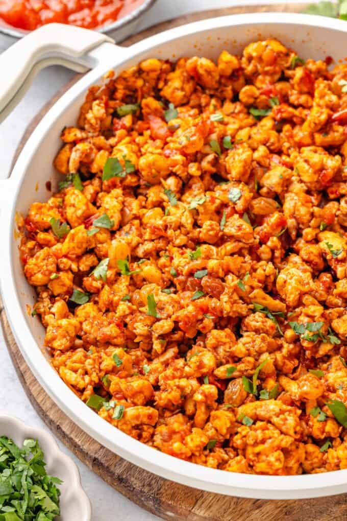 A quick chicken picadillo skillet with raisins and cilantro.